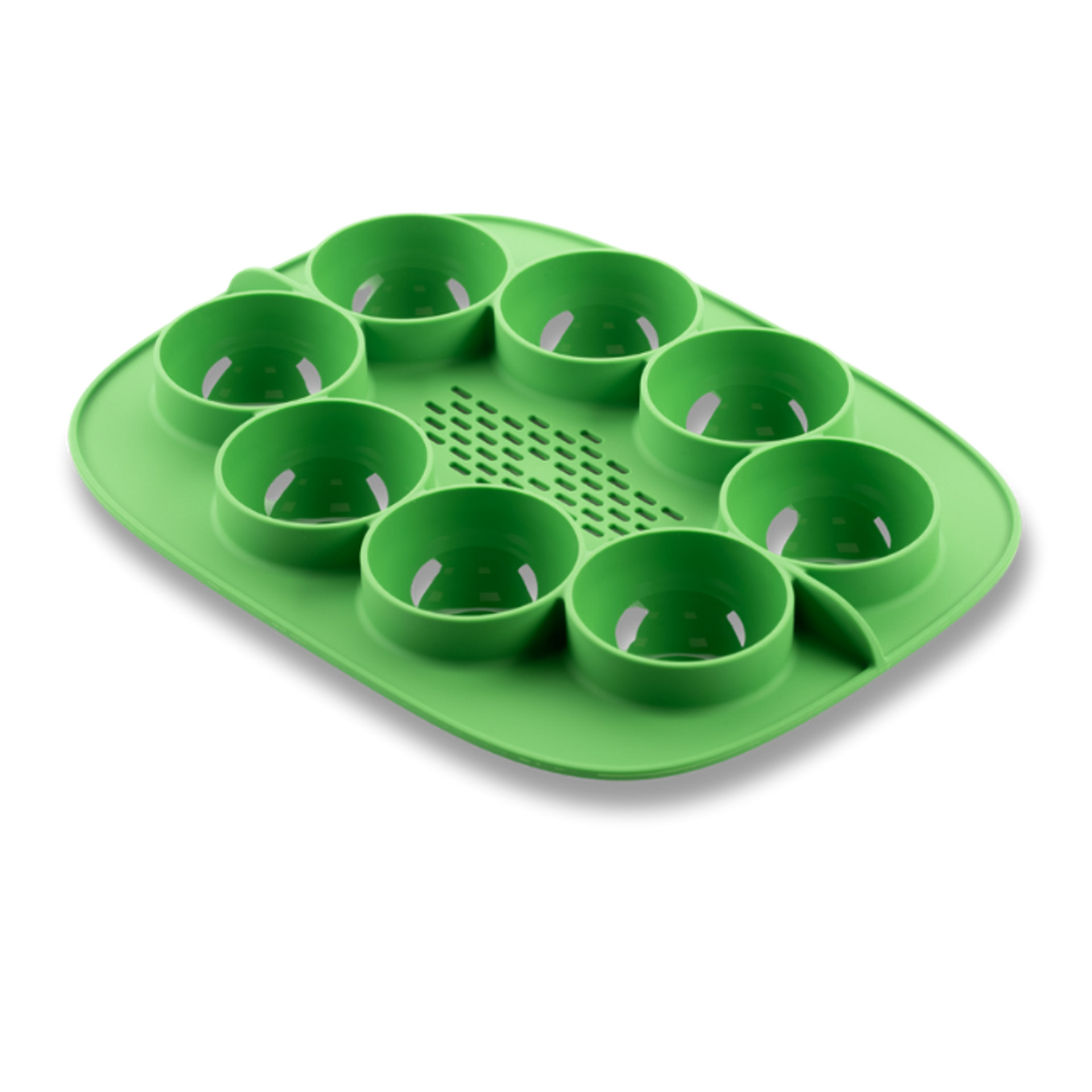 Vassoio verde in silicone per cottura a vapore con otto stampi, ideale per preparare più porzioni.