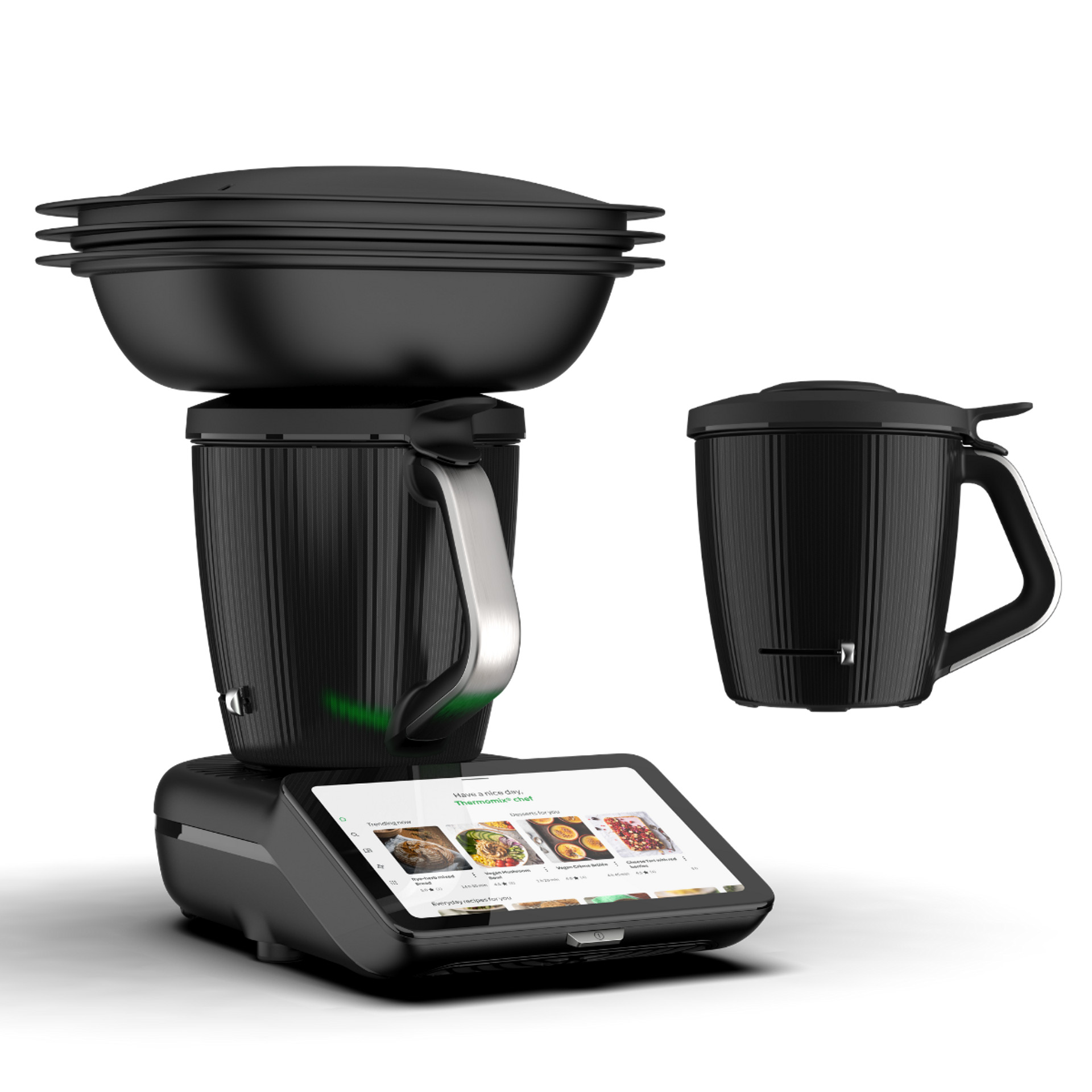 Thermomix® TM7 avec Varoma et bol supplémentaire sur l’écran.