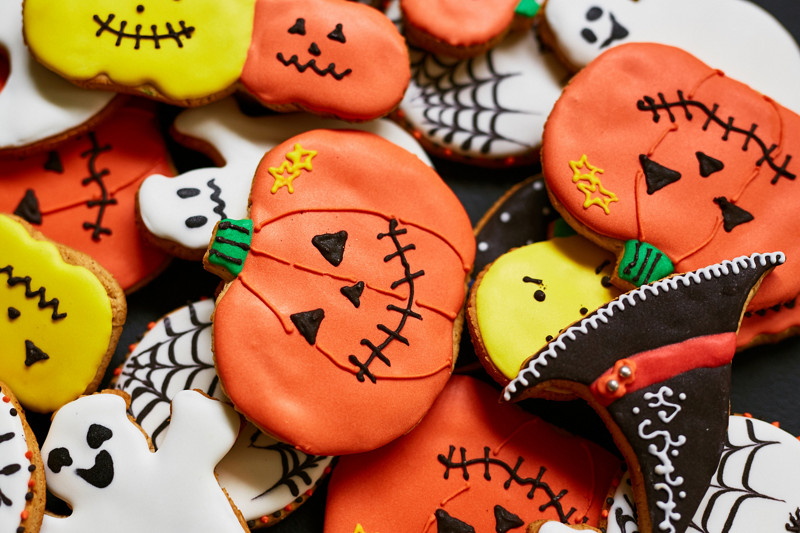 Trick-or-treat cookies in form of pumpkin, ghost and hat