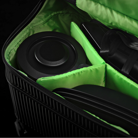 Black case with green padded dividers containing parts and accessories possibly for a Vorwerk household appliance