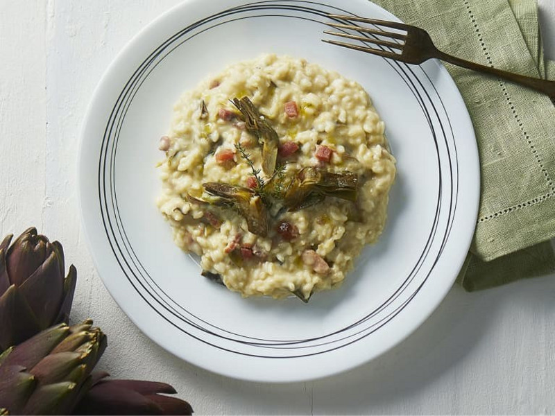 Segui la nostra ricetta passo-passo per un risotto ai carciofi perfetto, preparato facilmente con Bimby®. 