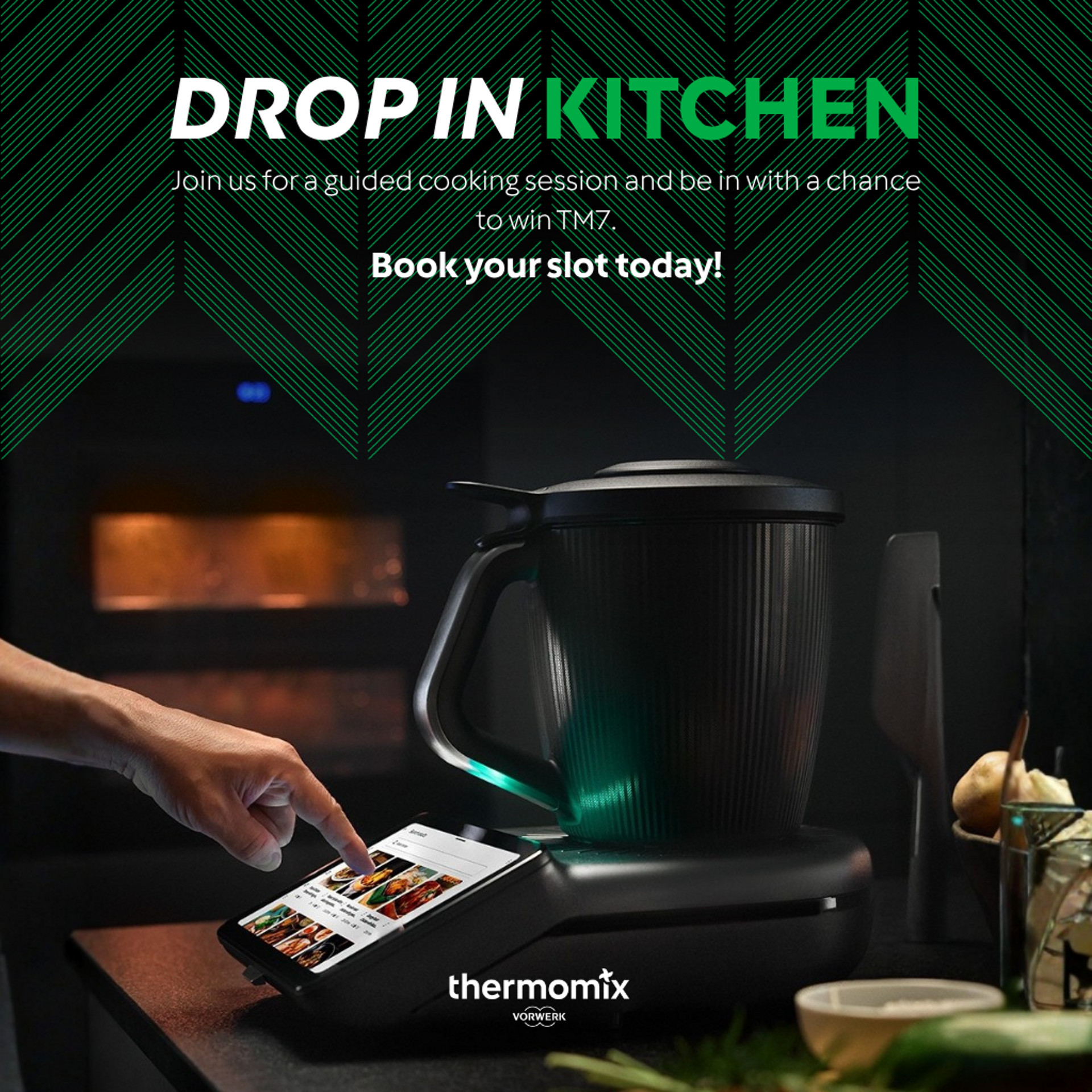 Person selecting recipe on Thermomix® TM7 touchscreen in a kitchen with oven and vegetables visible.