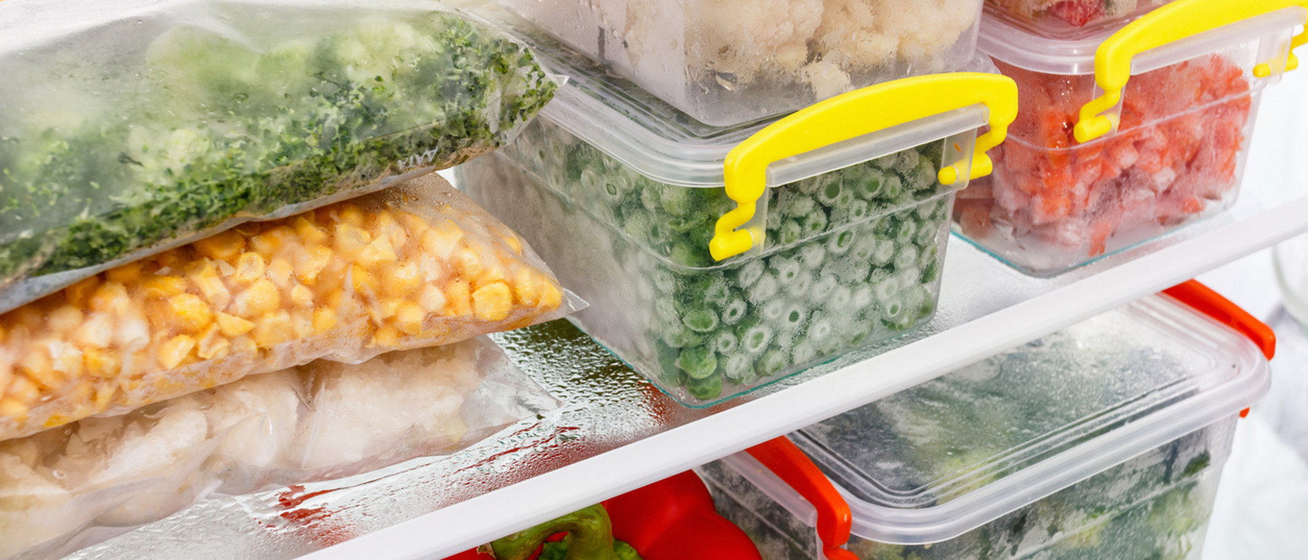 Frozen food in the refrigerator. Vegetables on the freezer shelves. Stocks of meal for the winter.