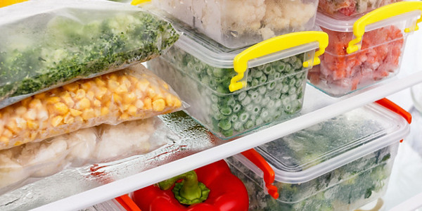 Frozen food in the refrigerator. Vegetables on the freezer shelves. Stocks of meal for the winter.