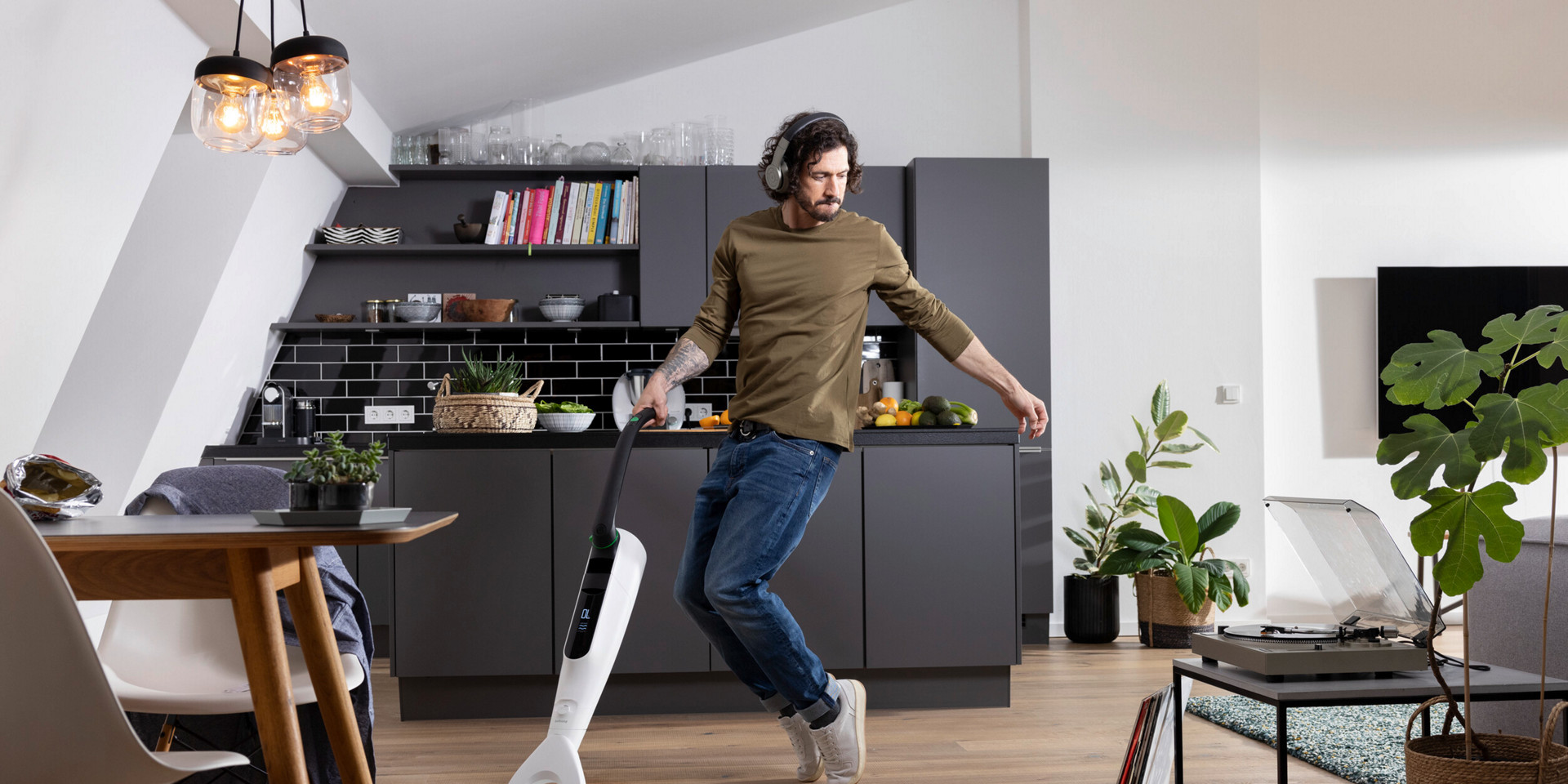 Man cleaning modern kitchen Kobold