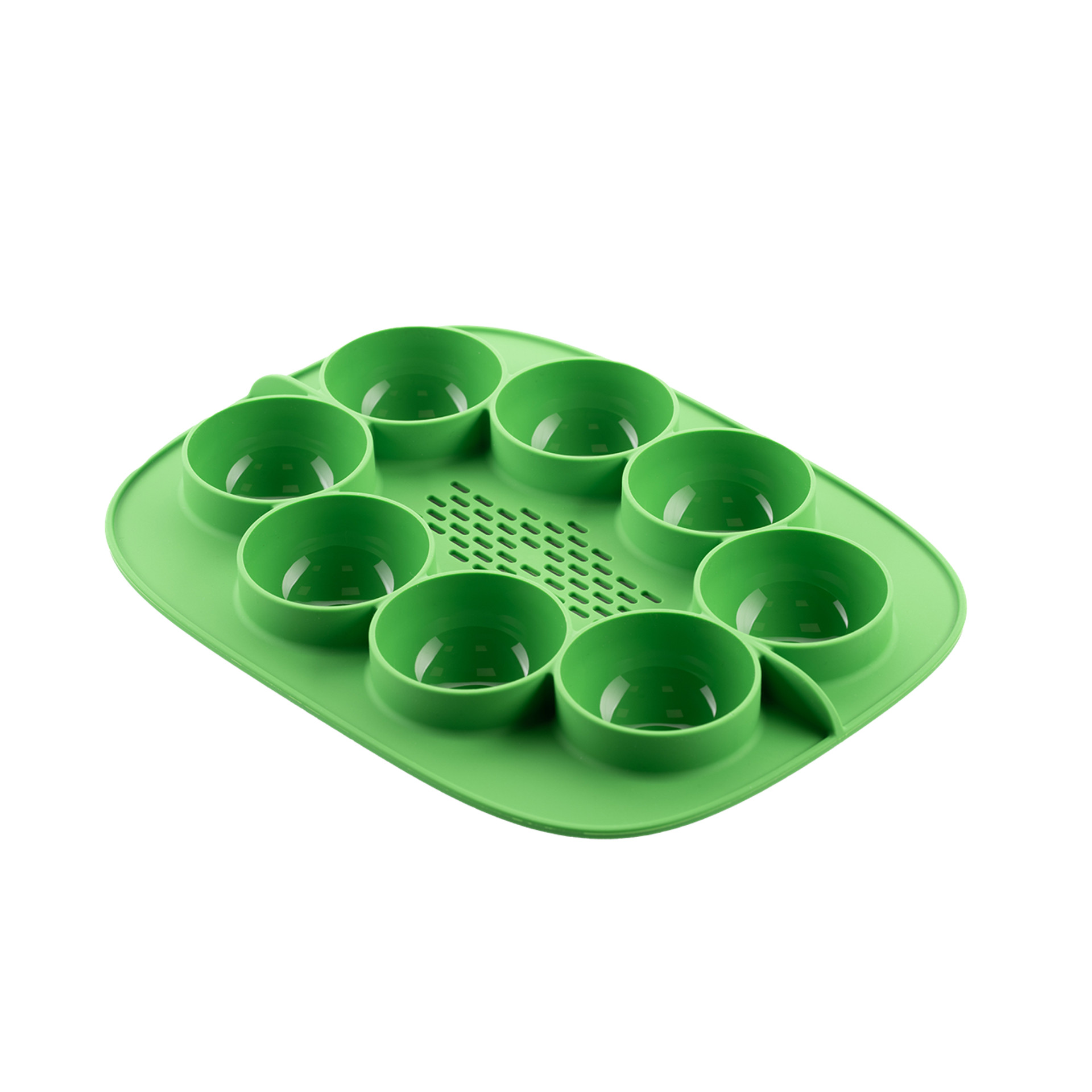 Green silicone egg tray with eight round molds, designed for steaming eggs or small portions.