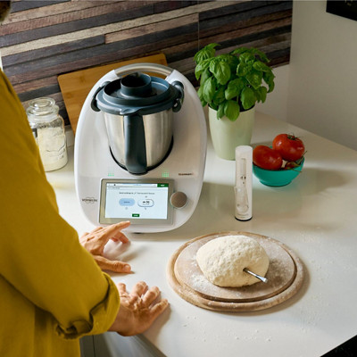 Man uses Thermomix® and Thermomix® Sensor for baking bread