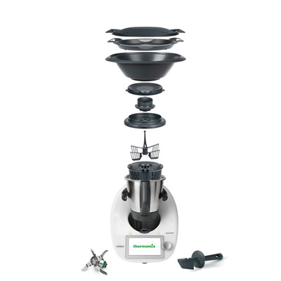 Thermomix® TM6 con accesorios en disposición explotada, mostrando cada componente separado sobre la base.