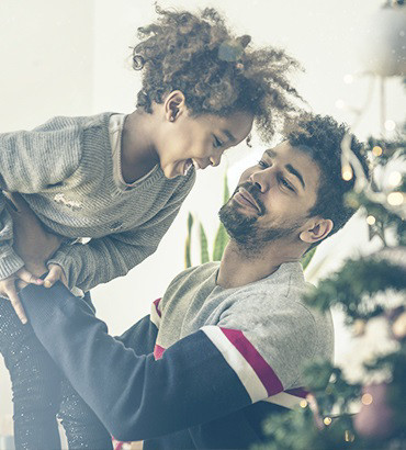 kobold blog man baby celebrating christmas tree