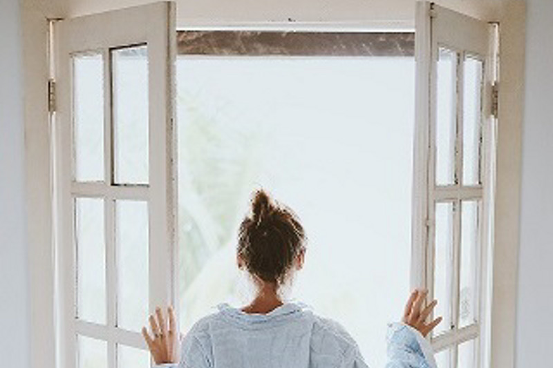 kobold blog woman opening windows back view