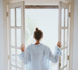 kobold blog woman opening windows back view