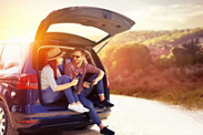 kobold magazin man woman sitting car trunk