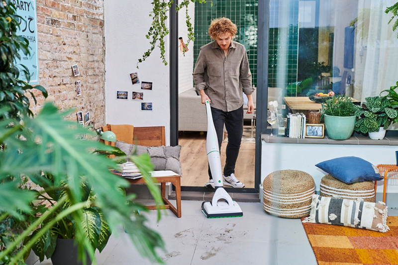 kobold vb100 front room man cleaning