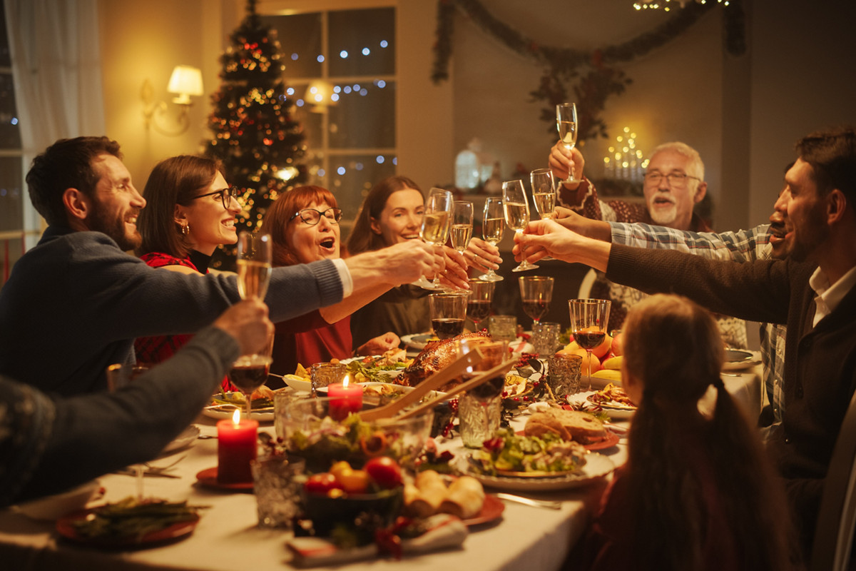 Portrait of a Handsome Young Black Man Proposing a Toast at a Christmas Dinner Table. Family and Friends Sharing Meals, Raising Glasses with Champagne, Toasting, Celebrating a Winter Holiday
