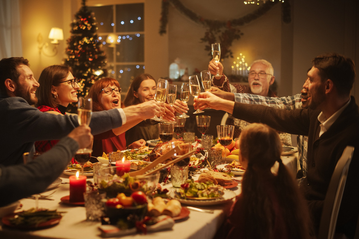 Portrait of a Handsome Young Black Man Proposing a Toast at a Christmas Dinner Table. Family and Friends Sharing Meals, Raising Glasses with Champagne, Toasting, Celebrating a Winter Holiday