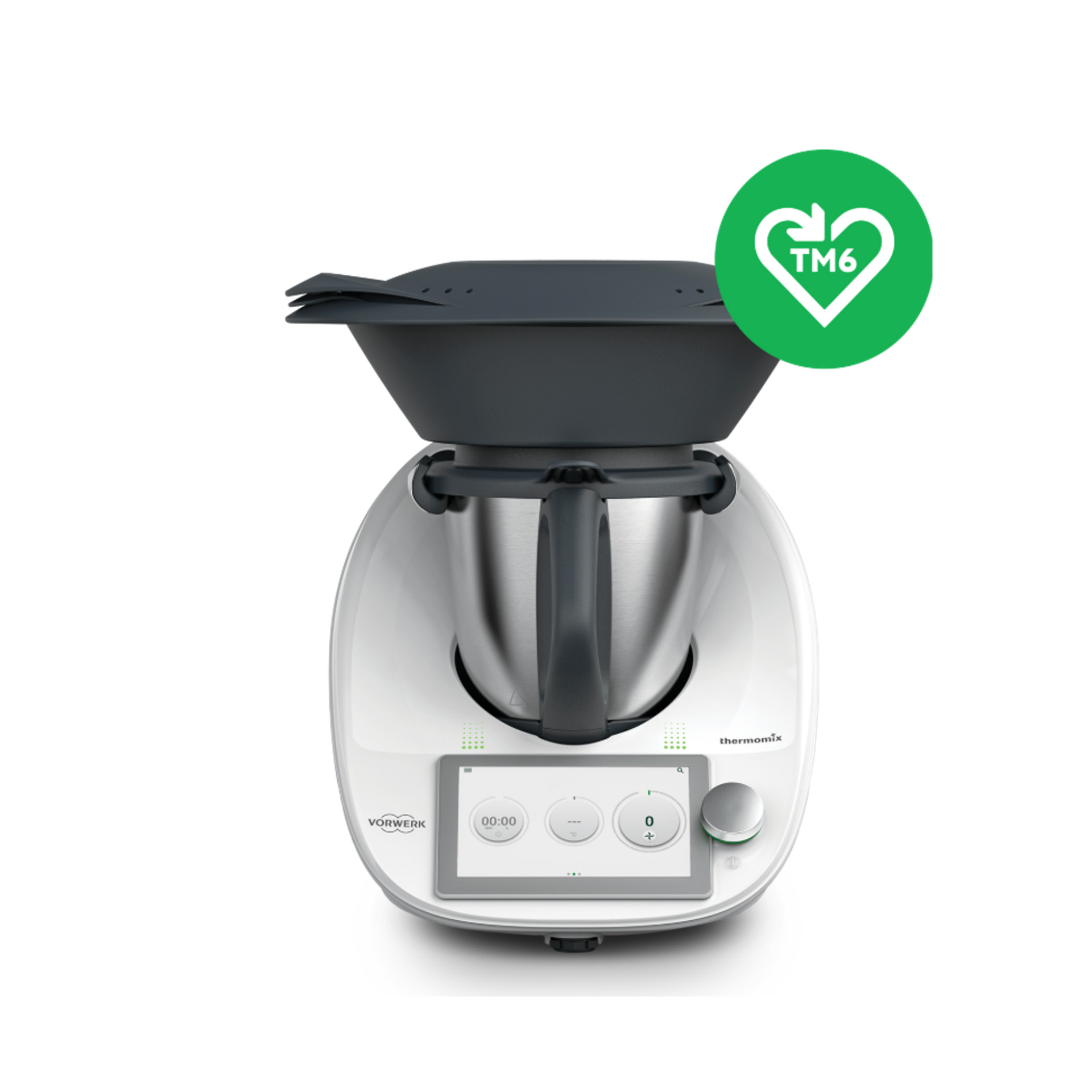 Thermomix® TM6 z nakładką Varoma oraz zielona ikona w kształcie serca z informacją o kompatybilności TM6.
