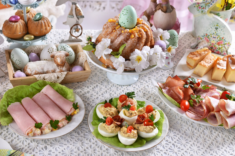 easter table with traditional dishes and cakes for festive breakfast