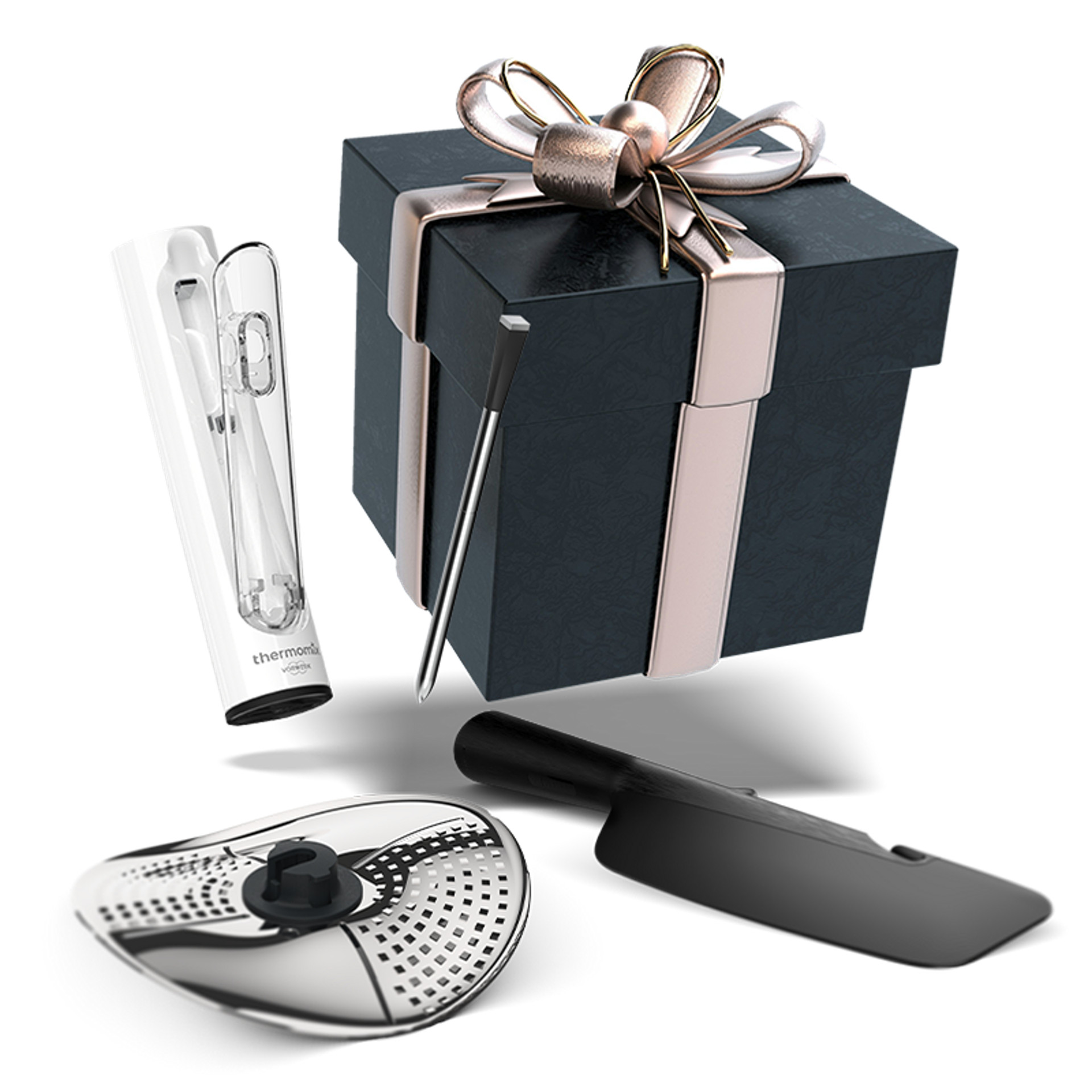 Gift box with Thermomix® Sensor, Thermomix® Peeler, and a black spatula in front.